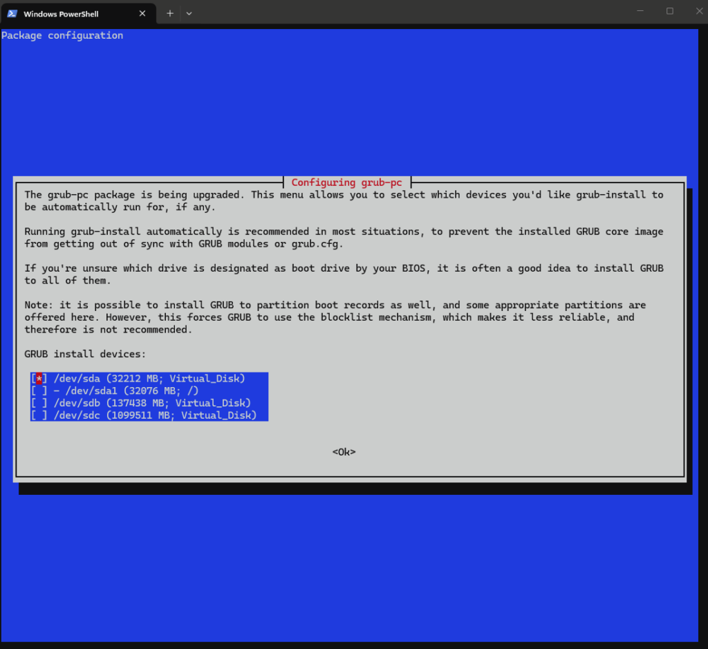 Écran bleu grub-pc demandant sur quels périphériques installer GRUB, avec /dev/sda sélectionné